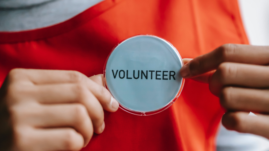 person with a volunteer tag