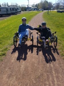 Dan and Paul side by side in their pedal bikes