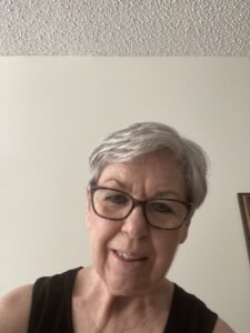 Woman with glasses smiling