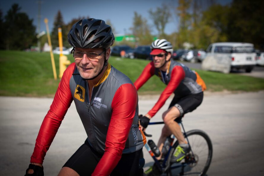 Two men riding on bikes