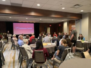Group of people sitting in a banquet room