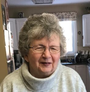 Woman with glasses smiling